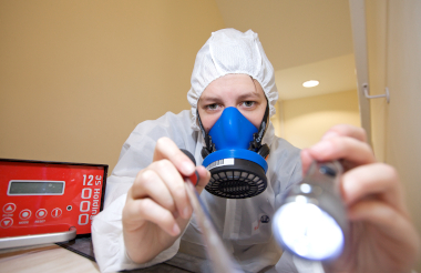 Asbestos analyst completing asbestos test