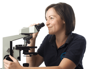 Legionella consultant, in Scientific Services' uniform, with a microscope.