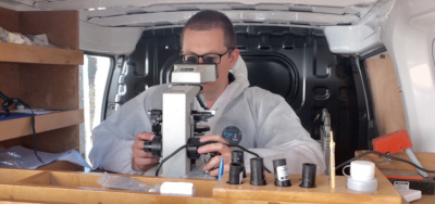 Air testing consultant counting a slide