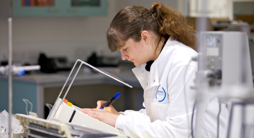 Scientist completing a test for laboratory auditing evaluation.