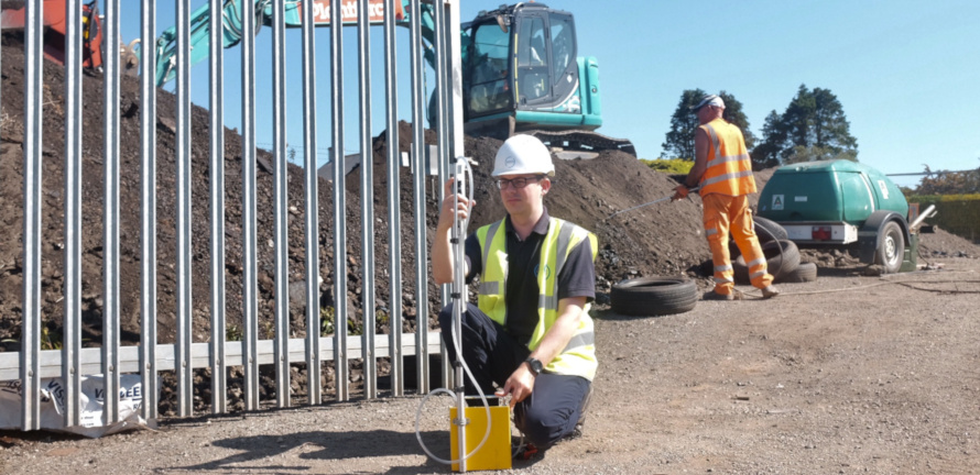 Asbestos consultant completing air monitoring at a site