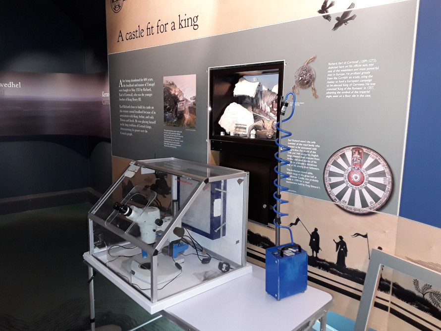 Display at Tintagel Castle with microscope Display at Tintagel Castle with microscope