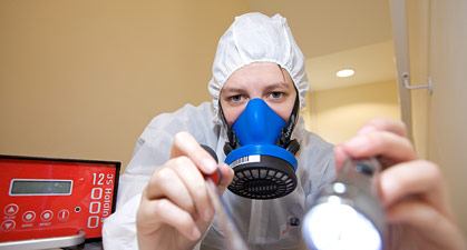 Asbestos surveyor with torch