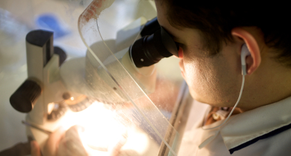 Analyst with microscope